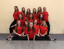 A group of kids in their dance studio shirts