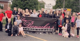 The entire dance studio at the parade, wearing the dance company apparel made by Logoeffect